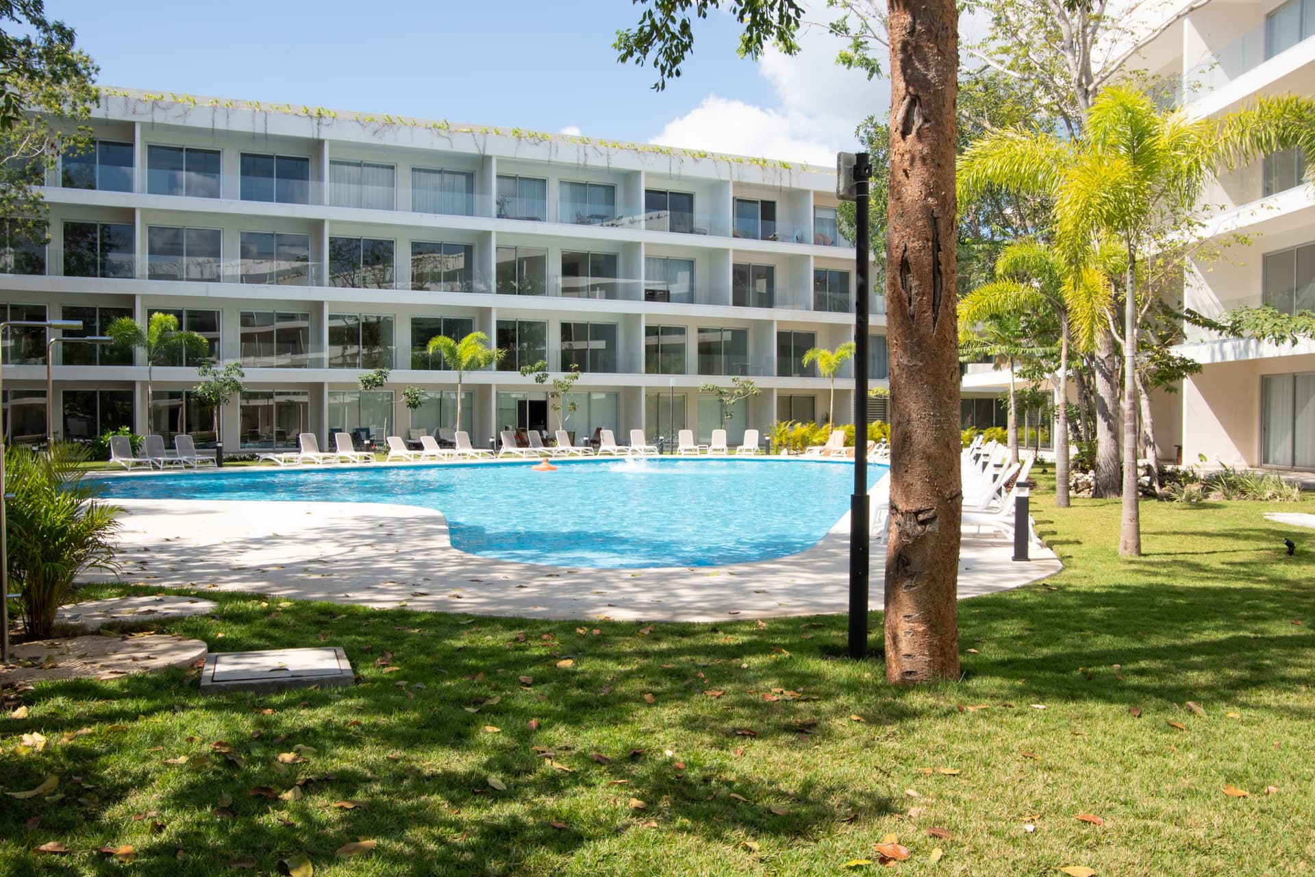 Resort-style community swimming pool at The Leaf Playacar